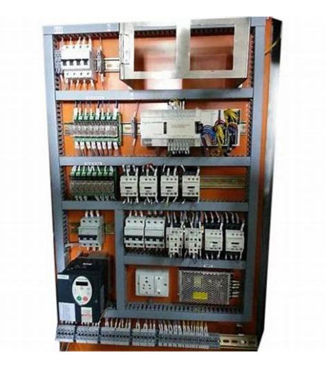 Inside view of a servo panel with multiple servo drives and PLC